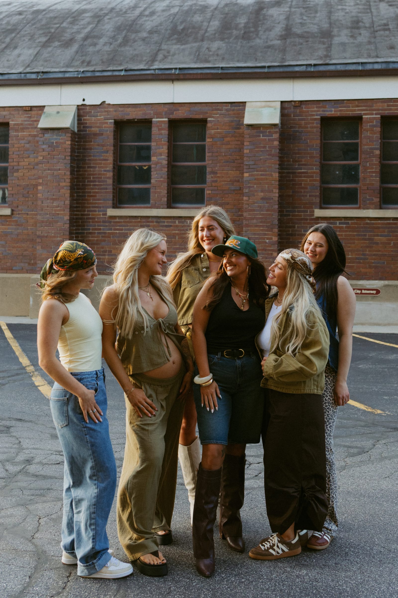 The Lounge Babes, the Artistry Lounge hair team Artistry Lounge team sharing a candid moment in downtown Bay City