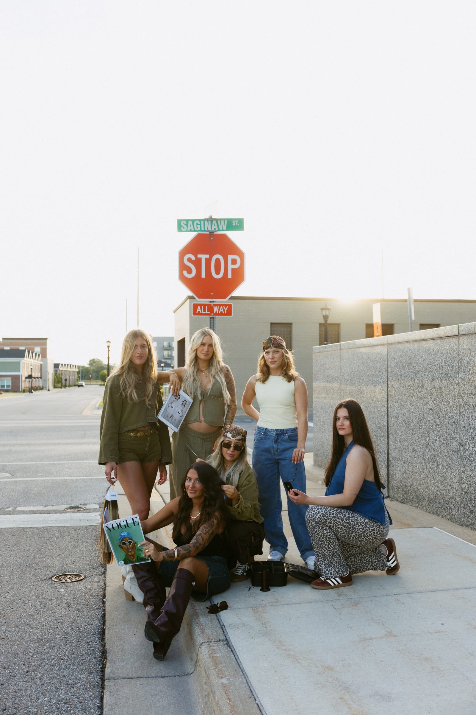Artistry Lounge stylists on Saginaw Street, Bay City Artistry Lounge team posing together on Saginaw Street in downtown Bay City